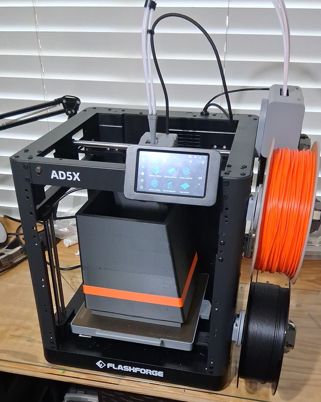 FlashForge AD5X multi-material 3D printer loaded with carbon-fiber filament